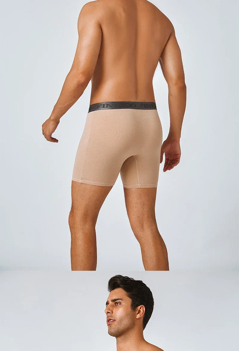 Man wearing beige compression shorts on a white background